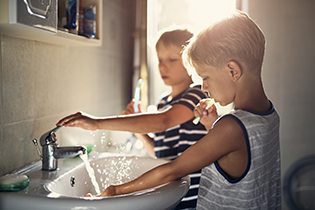 Children washing hands.